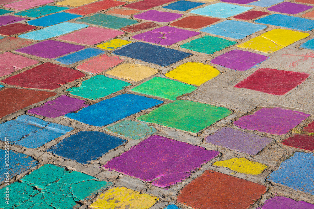 Rustic concrete tiles in brilliant colors of purple, green, blue, and red Rustic concrete tiles in brilliant colors of purple, green, blue, and red