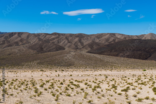 Barren volcanic hills and an alluvial fan in Death Valley National Park