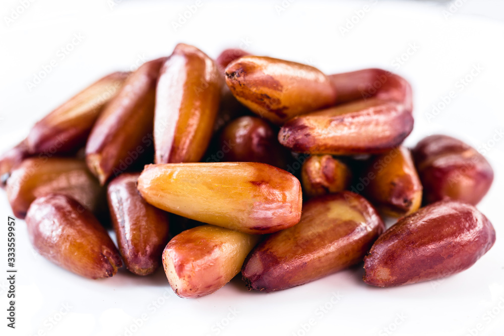 pine nut seed cooked and isolated over white background. Healthy and exotic Brazilian cuisine. pine nut seed cooked and isolated over white background. Healthy and exotic Brazilian cuisine.
