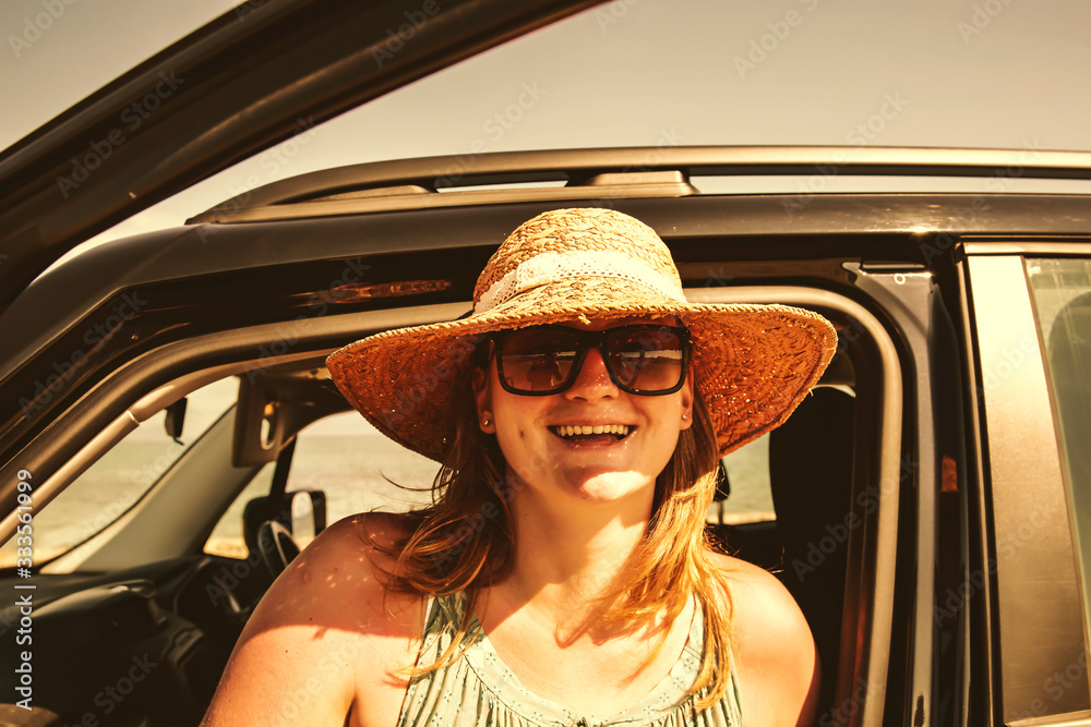 Fototapeta premium woman in summer car and free space for your decoration 