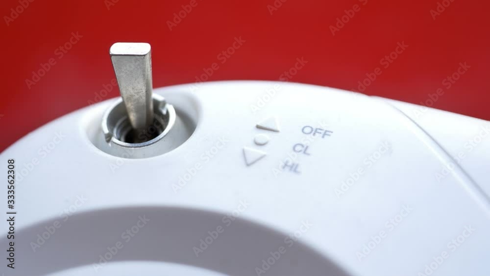 Hands turning the radio control switch on and off. Mini lever metal ...