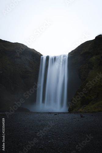 Beautiful Landscape image of a Waterfall in Iceland during dark moody weather 