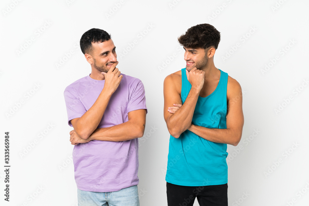 Fototapeta premium Two men over isolated background looking looking at each other