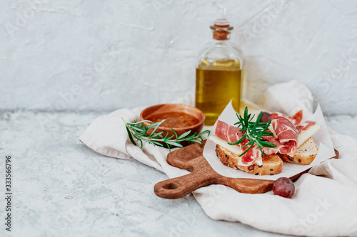 Spanish ham with toasts,rosemay,garlic and olive oil photo
