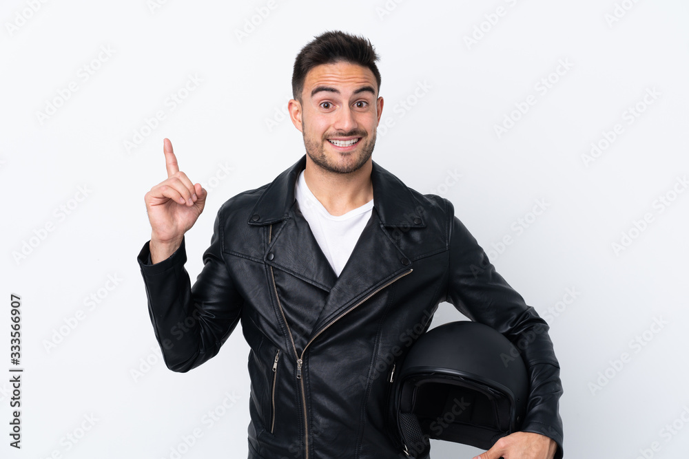 Man with a motorcycle helmet intending to realizes the solution while lifting a finger up Man with a motorcycle helmet intending to realizes the solution while lifting a finger up
