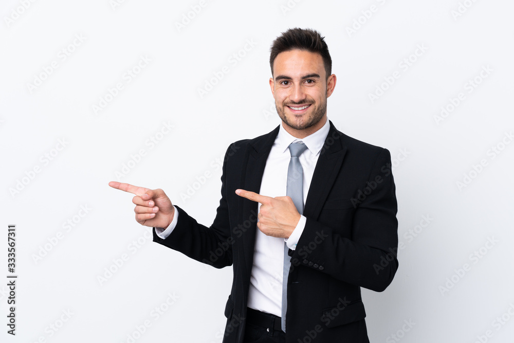Young business man over isolated background pointing finger to the side Young business man over isolated background pointing finger to the side