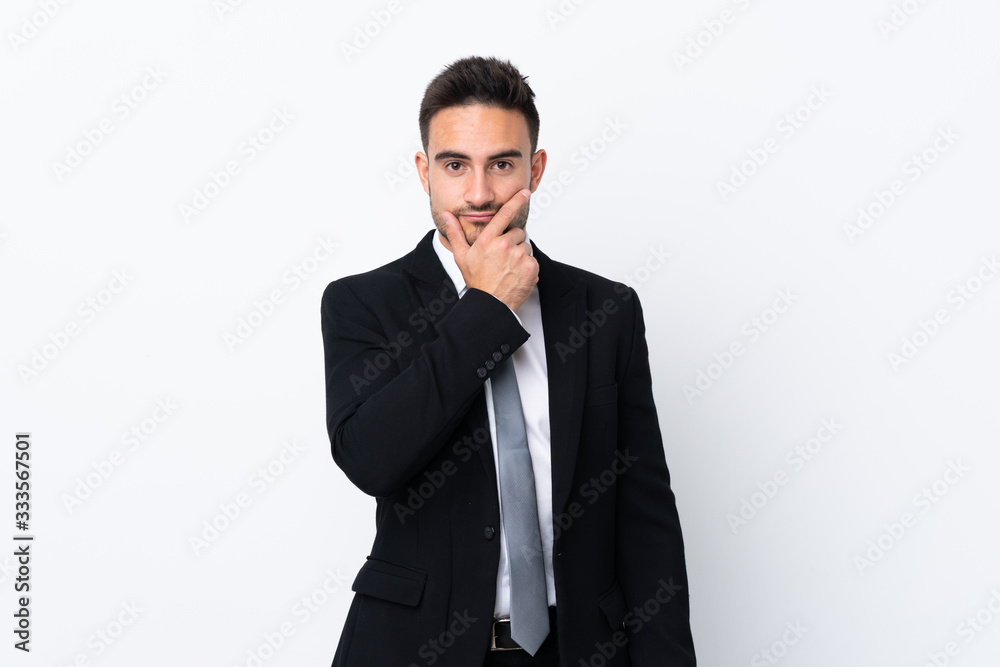 Young business man over isolated background thinking an idea Young business man over isolated background thinking an idea