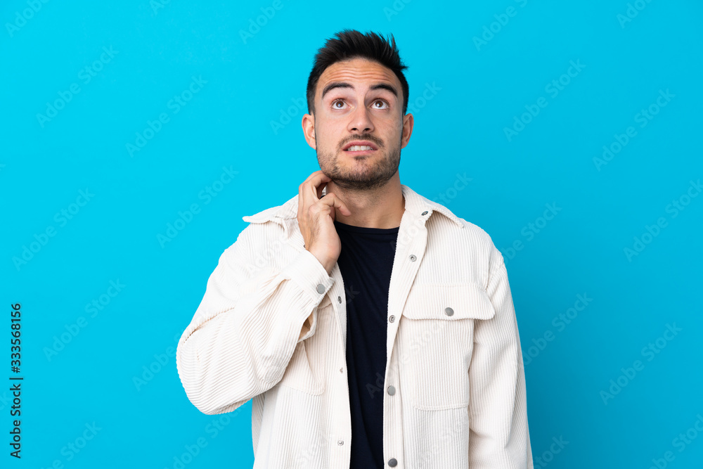 Young handsome man over isolated blue background thinking an idea Young handsome man over isolated blue background thinking an idea