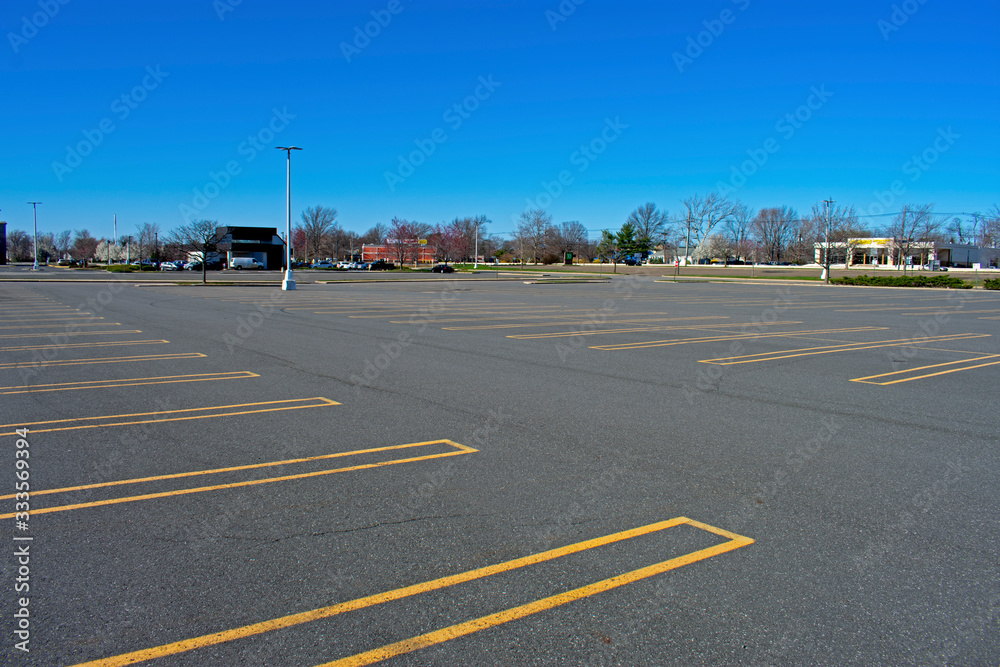 Empty parking lot in East Brunswick mall, New Jersey, on Friday afternoon, March 27th, 2020, as a result of store closings due to the Covid 19, the Corona Virus pandemic. -02