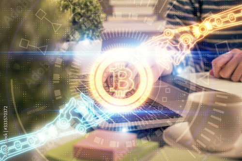 Double exposure of woman hands typing on computer and crypto market theme hologram drawing. Blockchain concept.