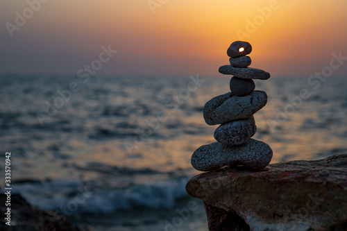 Zen concept. Sunset. The object of the stones on the beach at sunset.  Relax   Meditation. Zen stones