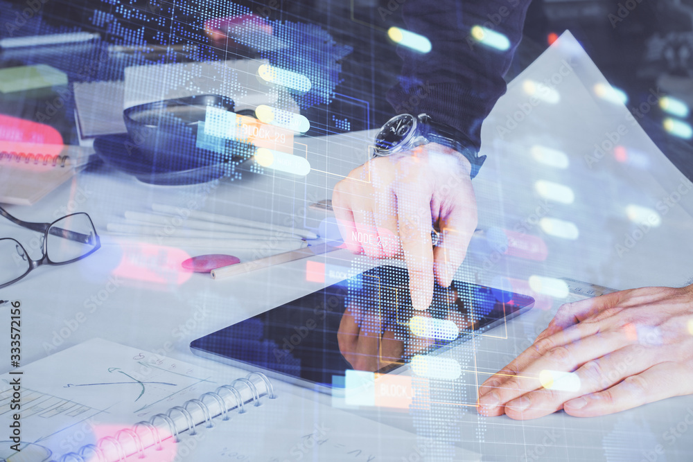 Double exposure of man's hand holding and using a digital device and data theme drawing. Technology concept. Double exposure of man's hand holding and using a digital device and data theme drawing. Technology concept.