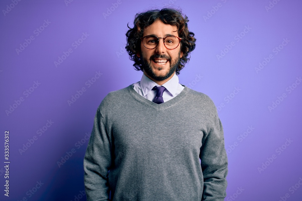 Handsome businessman with beard wearing tie and glasses standing over purple background with a happy and cool smile on face. Lucky person. Handsome businessman with beard wearing tie and glasses standing over purple background with a happy and cool smile on face. Lucky person.