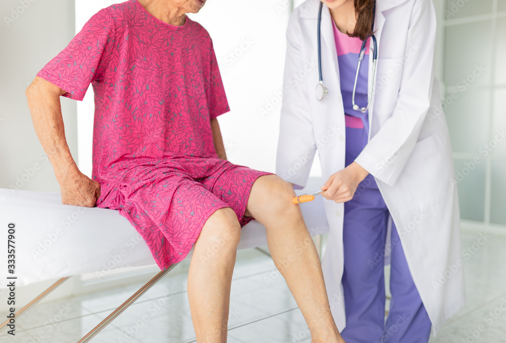 smart female doctor use hammer jerk hit to knee of patient, she assess