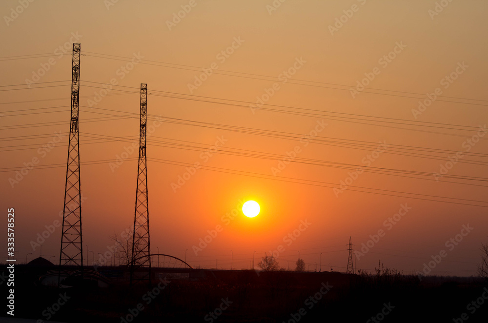Sunset on the background of the road and antennas. Beautiful landscape. Background.
