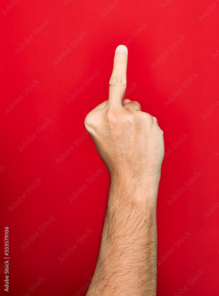 Beautiful hand of man doing fuck symbol with finger up