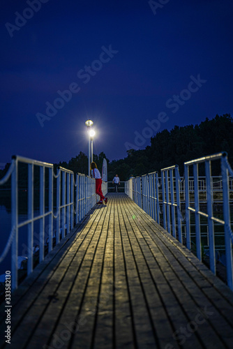 Girl on the pier at night