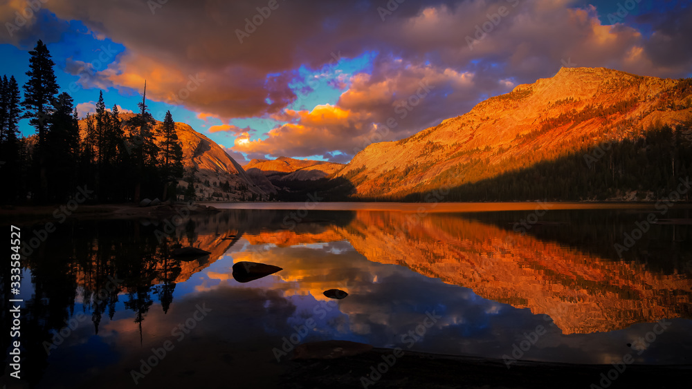 Tenaya lake reflection under sunset Tenaya lake reflection under sunset