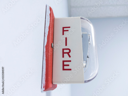 emergency fire alarm box attached to a wall inside a business