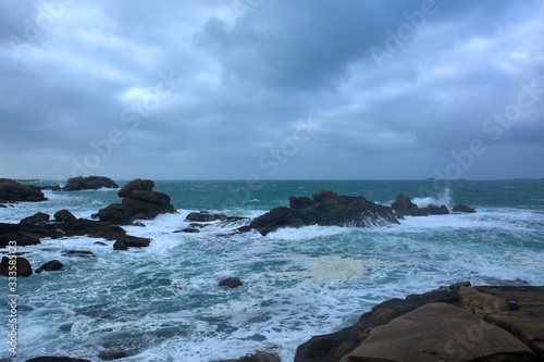 Beautiful view of the pink granite coast during storm in Brittany. France