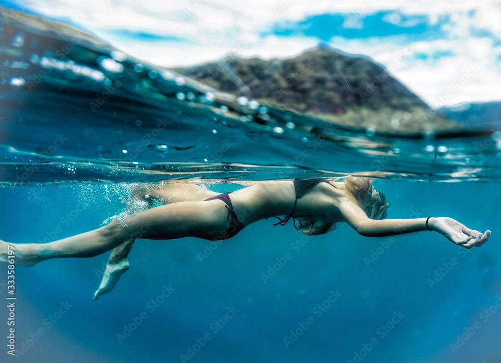 Beautiful Girl in the open ocean in Hawaii 