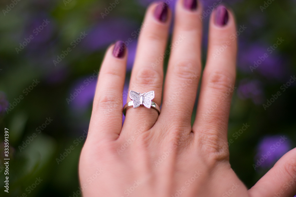 Fototapeta premium wedding rings on hands of groom and bride