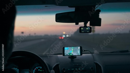 Navigator in a car while driving in the morning