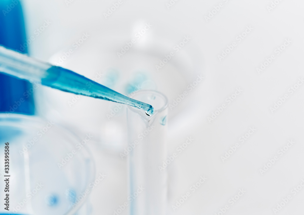 Blue Liquid dropping into a Test Tube