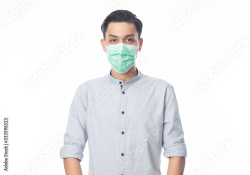 Young Asian Businessman wearing hygienic mask to prevent infection, 2019-nCoV or coronavirus. Airborne respiratory illness such as pm 2.5 fighting and flu isolated on white background. © Touchr