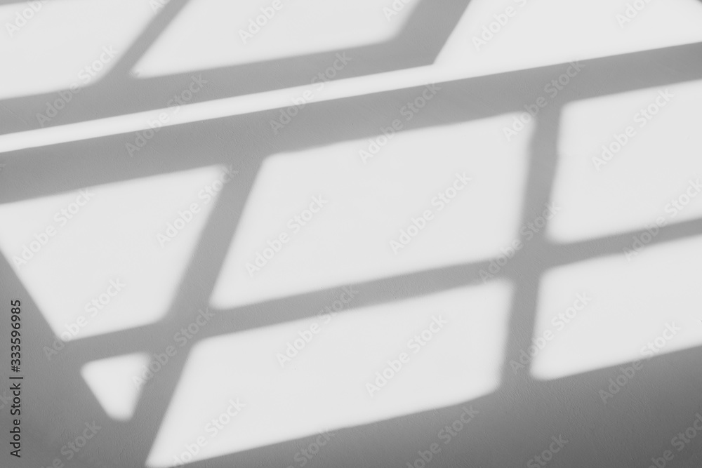 abstract shadow of the window in morning light on white wall texture background abstract shadow of the window in morning light on white wall texture background