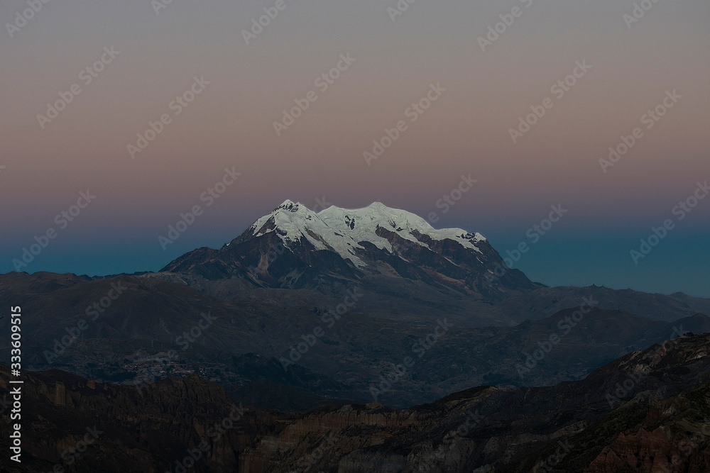 Illimani mountain at blue hour in La Paz - Bolivia (3600m.a.s.l.)