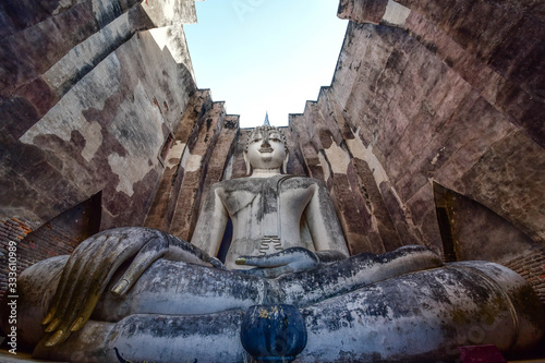 The Buddha statue of the Marvichai posture is named  Phra Achana   Wat Si Chum  Sukhothai Province  Thailand.