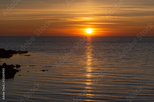 Sunset over the ocean. Orange sea background. Sunset on the sea