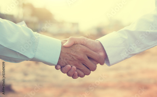 Close up people hands shake business partnership success,Shake hand concept