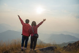 rear of happy couple love stand on top mountain looking view at Mulayit Taung, Myanmar. soft focus and vintage tone.