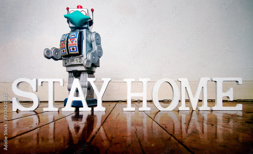 Naklejka premium robot an message STAY HOME 