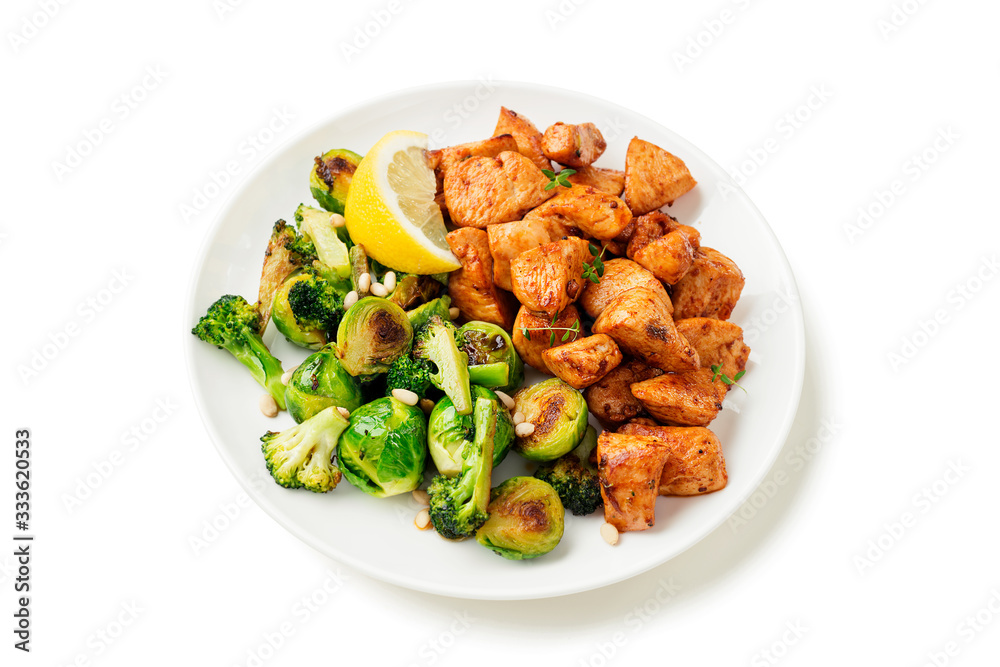 Roasted chicken meat and grilled vegetables isolated on white background Roasted chicken meat and grilled vegetables isolated on white background