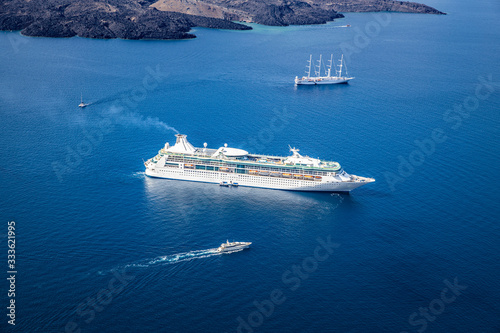 Beautiful landscape with sea view. Cruise liner at the sea near the islands. Santorini island, Greece. © icemanphotos