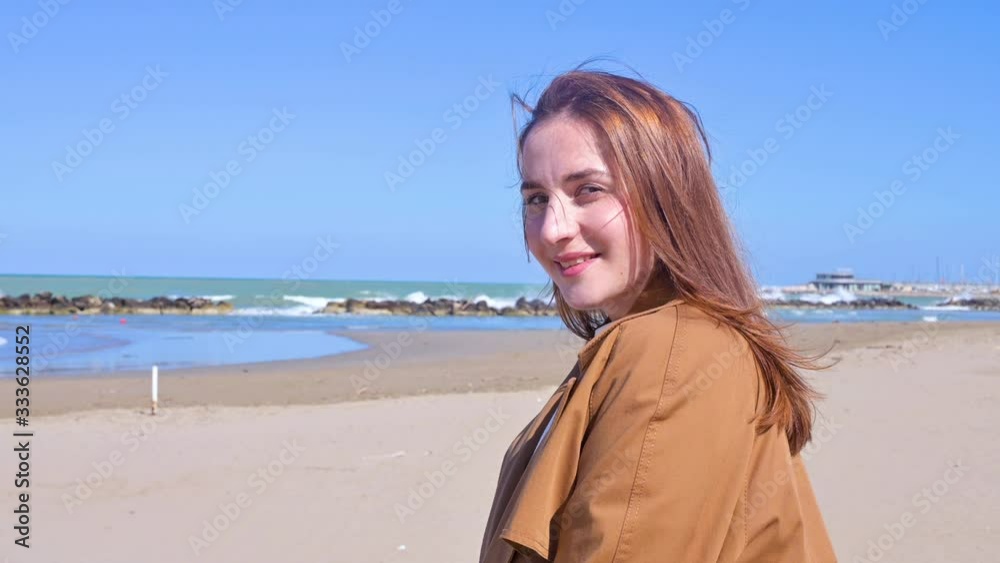 A girl walks on the beach. Air kiss. Happy young woman having fun on the seashore. The concept of tourism and travel. The emotions of real life. Close-up face. 4k video A girl walks on the beach. Air kiss. Happy young woman having fun on the seashore. The concept of tourism and travel. The emotions of real life. Close-up face. 4k video