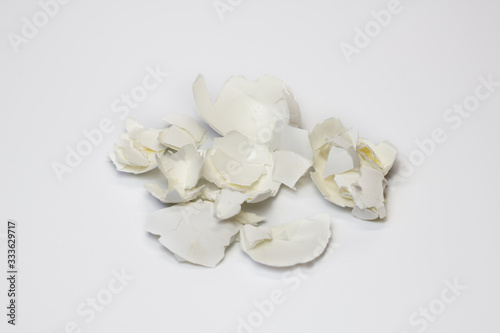 Food waste eggshell on a white background. Isolate. Close up. Waste for recycling. Responsible disposal of household food wastage in an environmentally friendly way by recycling.