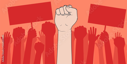 Demonstration of protesting crowds people with raised hands and banners, a mass protest.