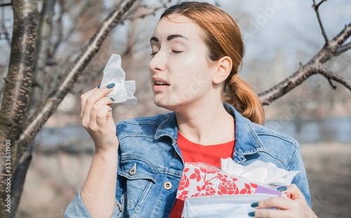 Allergy concept, woman in outside have a allergic reaction photo