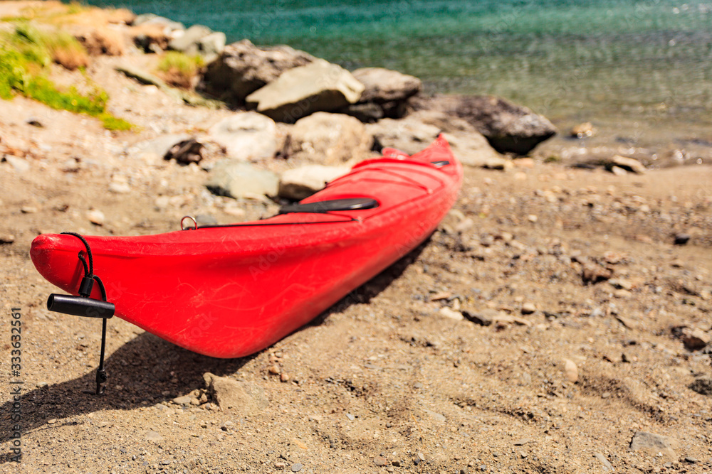 Kayak on water shore.