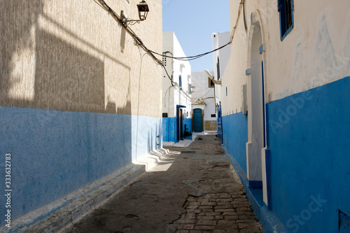 Blue painted cozy street in old city of Rabat. © leospek
