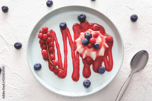 Photos Plate with tasty panna cotta on white background