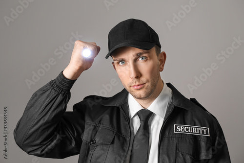 Male security guard with fl...