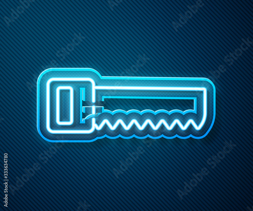 Glowing neon line Hand saw icon isolated on blue background. Vector Illustration