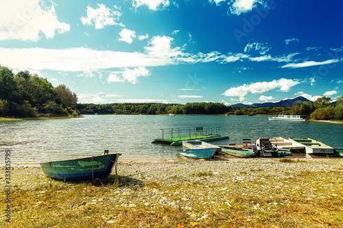 Boat on a lake shore. Lake background.