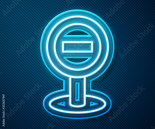 Glowing neon line Stop sign icon isolated on blue background. Traffic regulatory warning stop symbol. Vector Illustration
