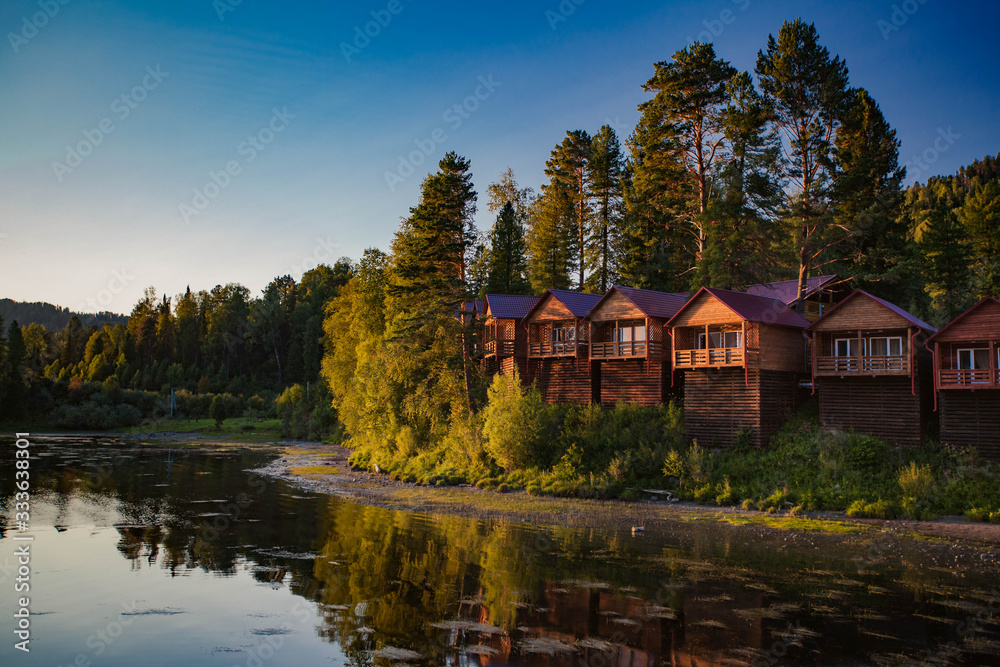 Cozy cabins in the forest near the river